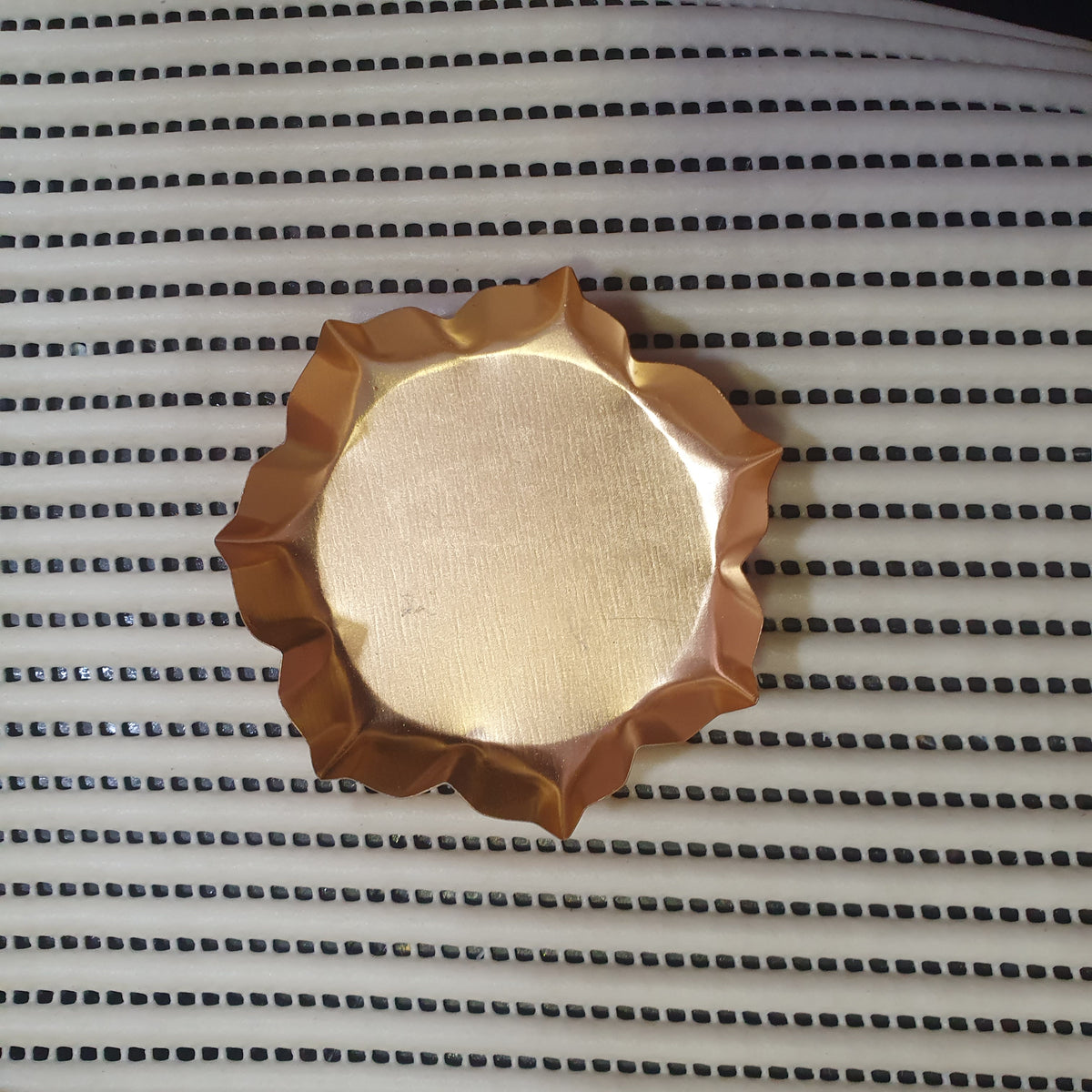 golden metal urli bowl
