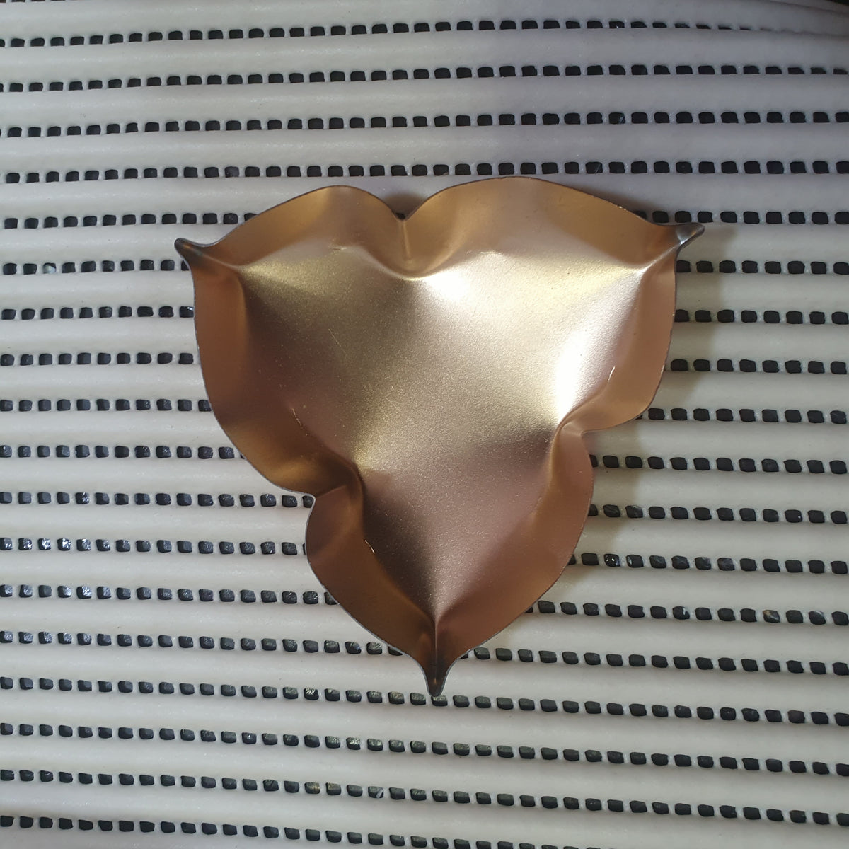 golden metal urli bowl