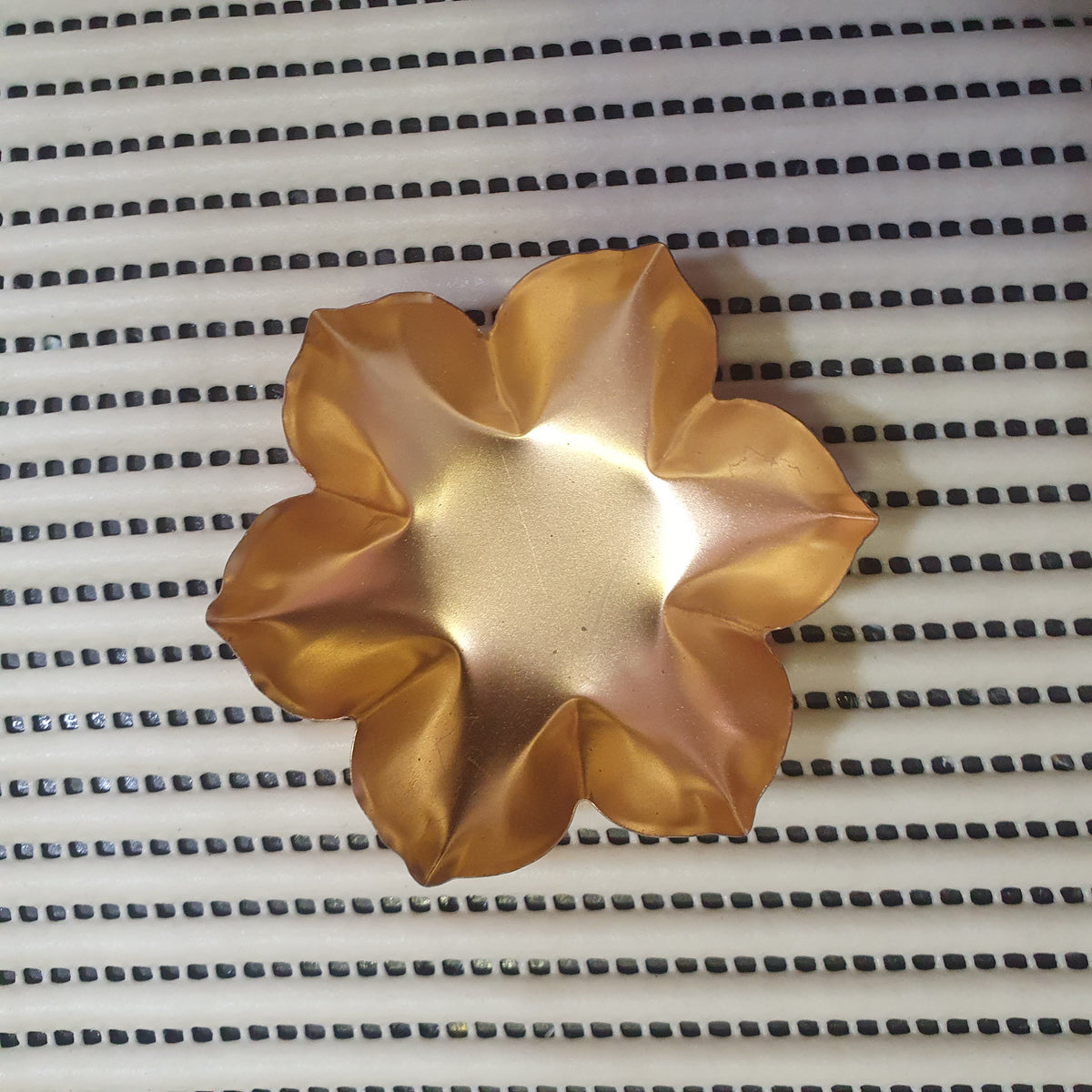 golden metal urli bowl